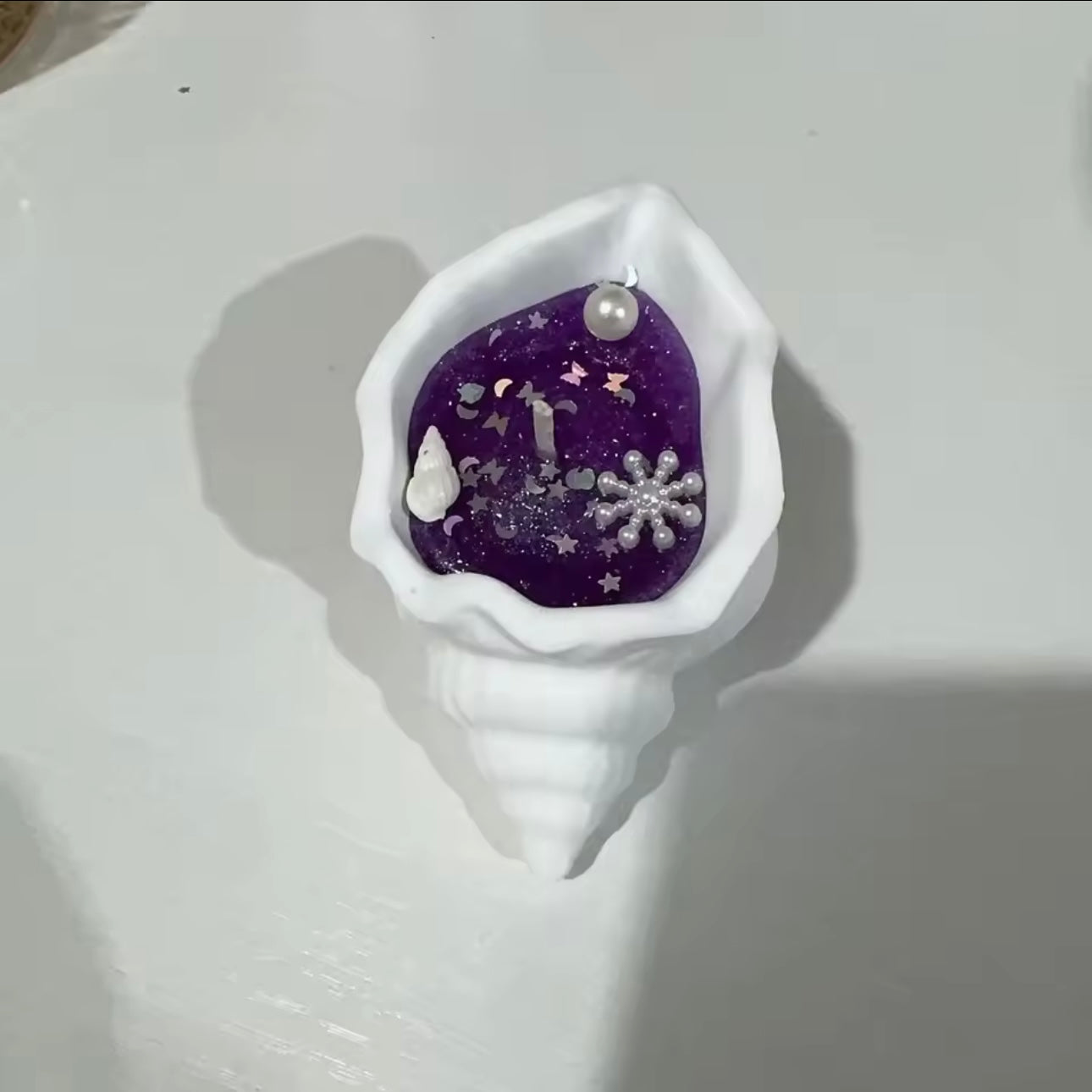 Vela aromática en forma de conchita de mar